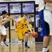 Saline senior Reece Dils drives down the court on Friday, Feb. 1. Daniel Brenner I AnnArbor.com